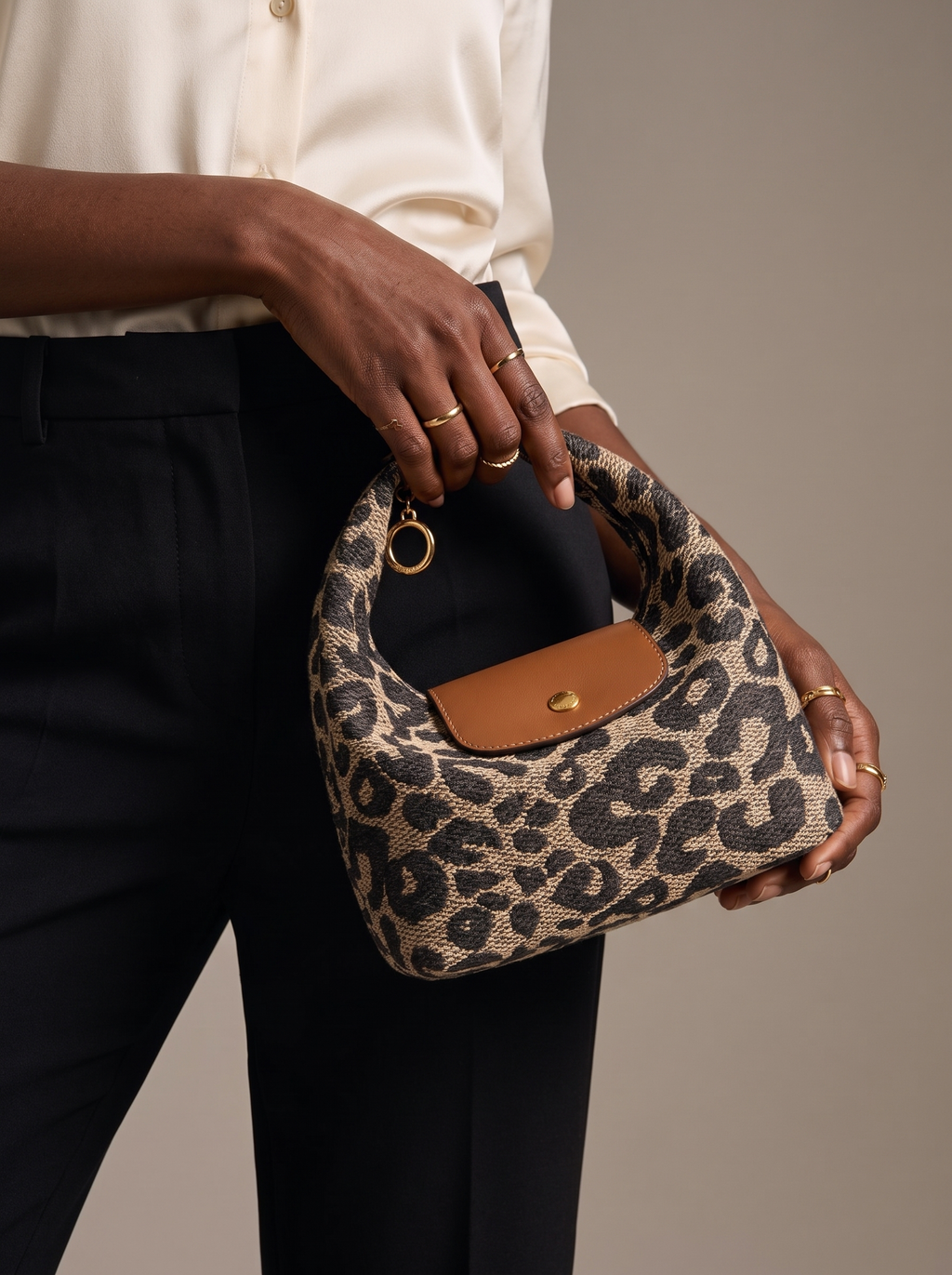 Hands cradling the Leopard Deauville