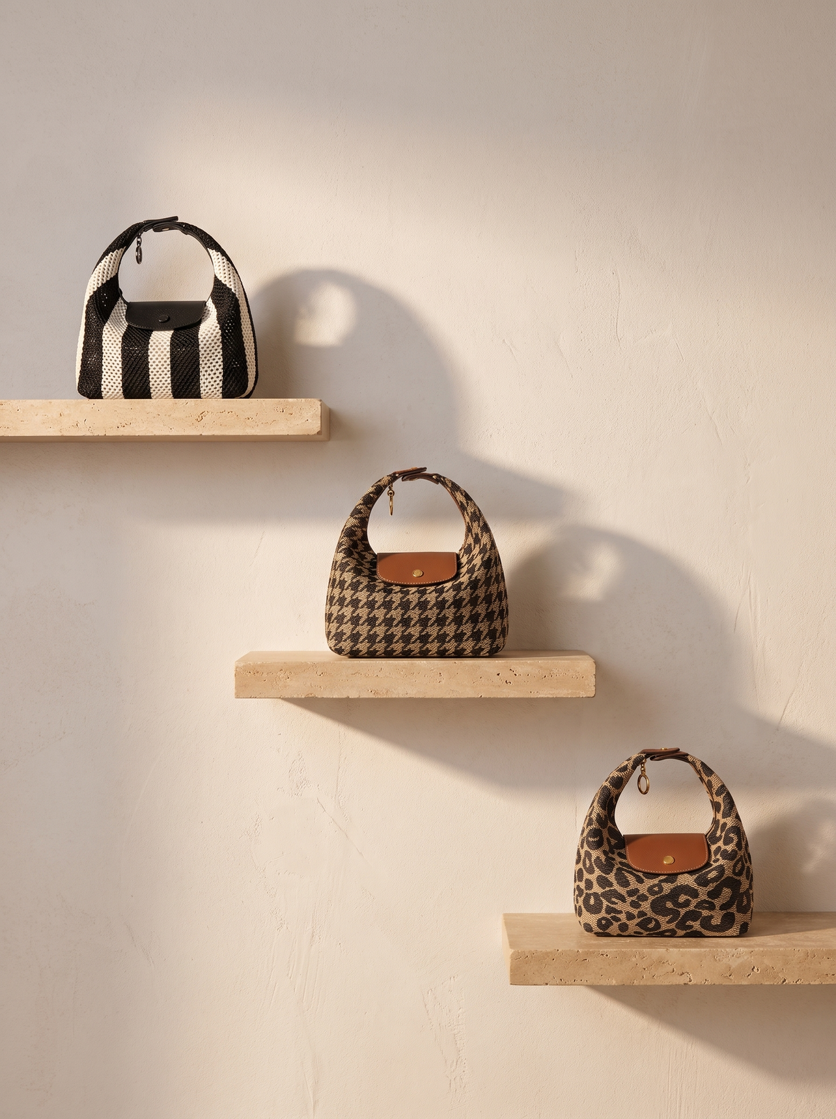 The Deauville in Stripe Noir, Houndstooth and Leopard on stone shelves