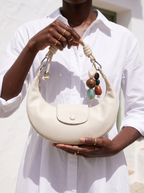 The Demilune in Ivory, held in both hands