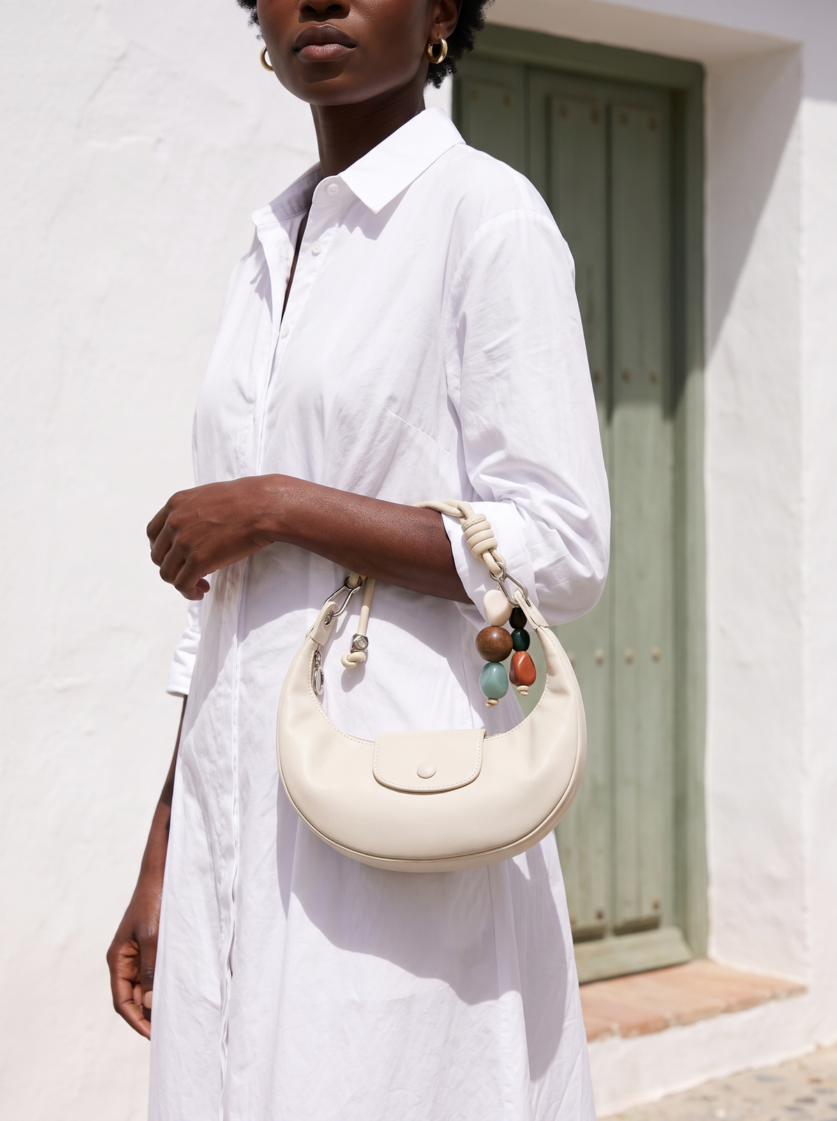 The Demilune in Ivory, carried by hand in a whitewashed lane