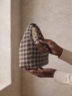 The Deauville in Houndstooth, turned to the light in the hands
