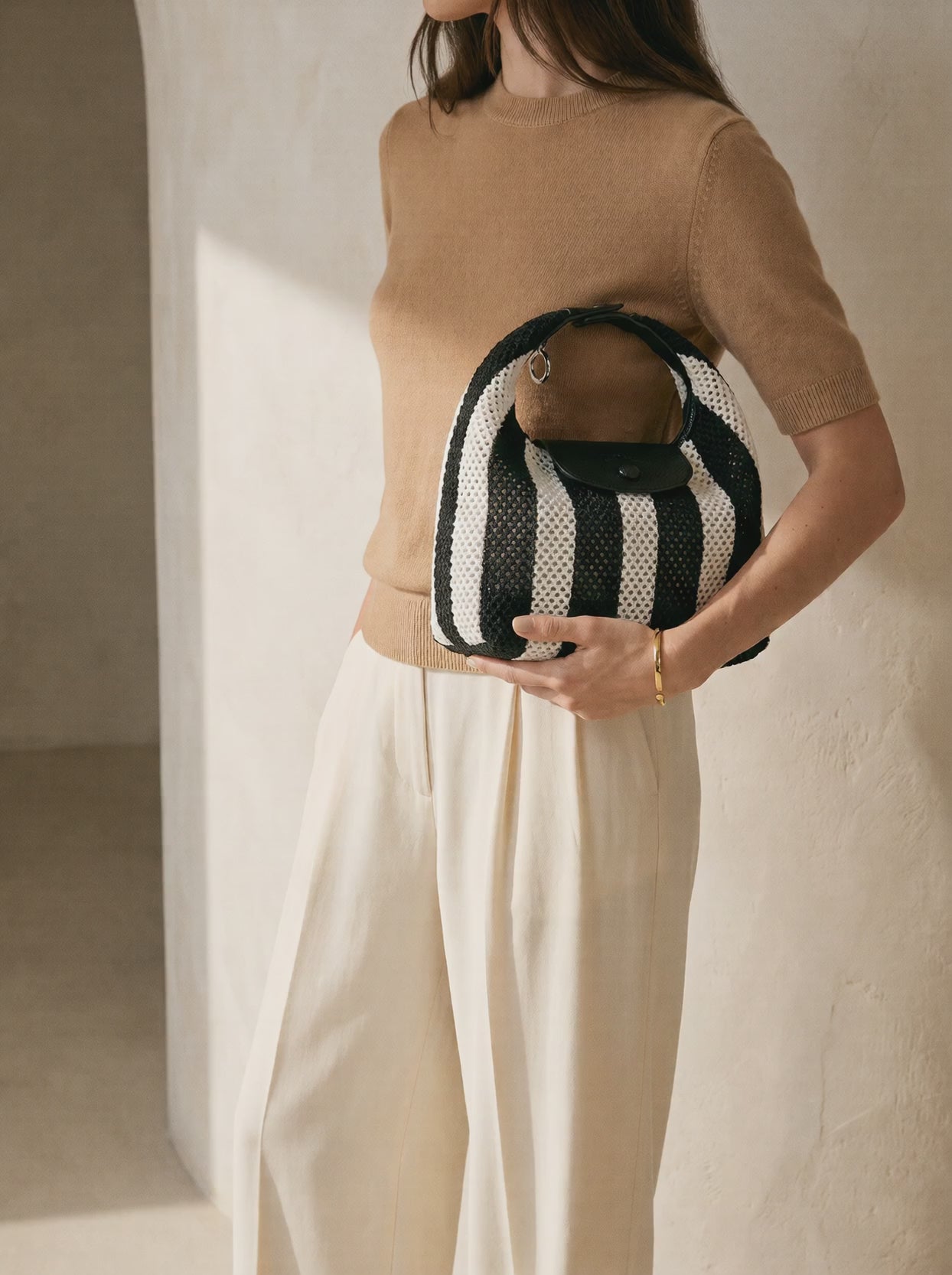 The Deauville in Stripe Noir, carried under the arm film