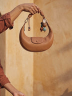 The Demilune in Caramel, lowered into the palm in the evening sun
