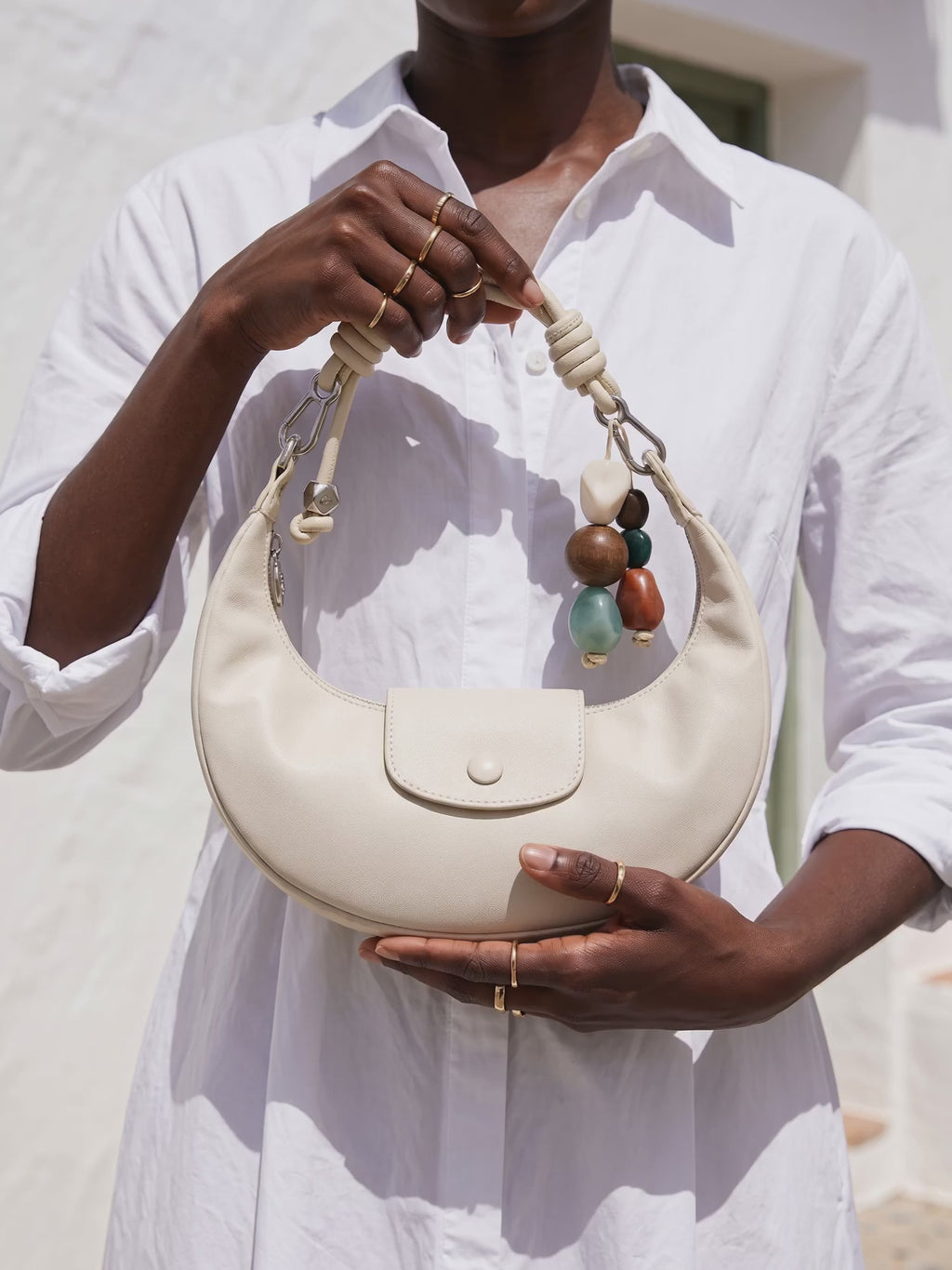 The Demilune in Ivory, held in the noon sun