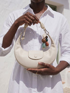 The Demilune in Ivory, held in the noon sun